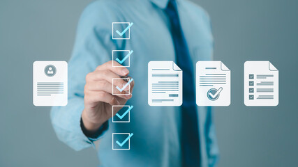 Businessman conducting online surveys and digital form checklists on a virtual screen, document...