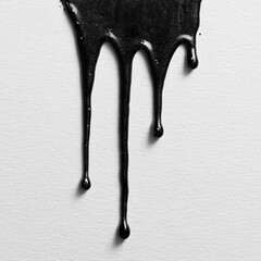 Black paint drips on white surface