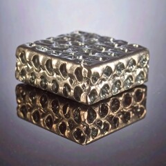 Textured metallic cube; reflective surface