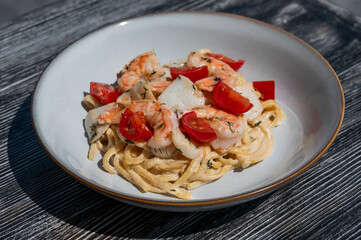 Pasta with shrimp and tomatoes. 