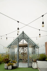 minimalist decoration of small house in the middle of garden with hanging lights