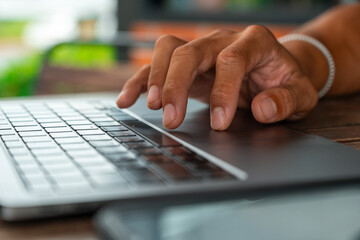 Professional using notebook and smartphone in a cafe setting, representing business, trade, finance, remote working, and productivity in a modern workspace lifestyle.