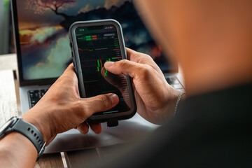 Professional using notebook and smartphone in a cafe setting, representing business, trade, finance, remote working, and productivity in a modern workspace lifestyle.