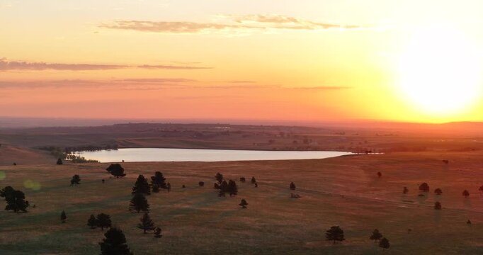 Boulder Colorado golden hour sunrise early morning sun on Front Range plains Arvada Golden aerial drone spring summer Marshall Lake Baseline Reservoir Eldorado Canyon Greenbelt Plateau parallax right
