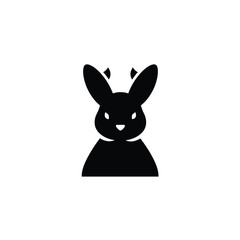 Black rabbit silhouette with long ears and small horns