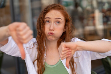 Expressing disappointment in a cafe setting during a sunny afternoon