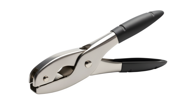 Silver metal hole puncher isolated on transparent background in a studio shot