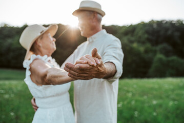 Elderly man and woman spending time in nature.