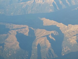 Stunning aerial view of rugged mountain terrain showcasing unique natural formations during a clear...