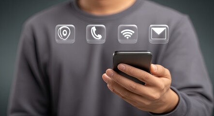 Person holding a phone with contact icons