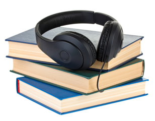 Headphones on books isolated on white.