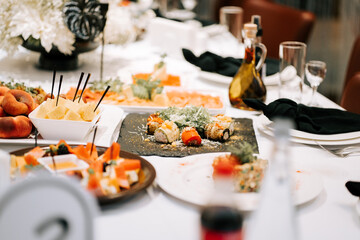 Elegant dining experience featuring assorted dishes at a beautifully set table in a restaurant