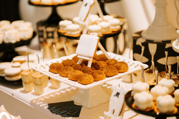 Dessert display with assorted pastries and treats in elegant arrangement at an event venue