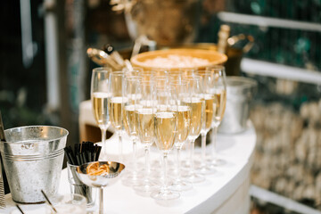 Elegant champagne toast setup at a celebration event with refreshments and decor