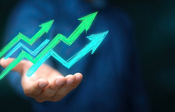 Open hand displaying upward trending graphs