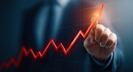 A hand, in a business suit, points to a rising red graph