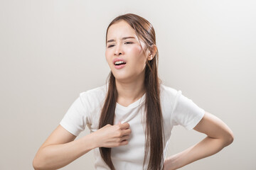 Obraz premium Hot weather and health care concept asian young woman suffering from heat, feeling discomfort with sunstroke at summer, wave her hand fan, female gesture fatigue wearing t-shirt in high temperature.