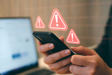 Smartphone user receives multiple digital warning alerts indicating security risks or urgent notifications