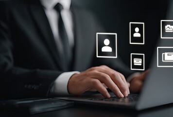 Businessman using laptop with floating user & financial icons