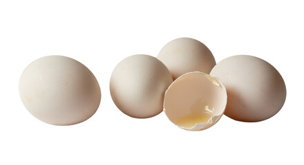 White Eggs and Broken Shell with Yolk on a Soft Background