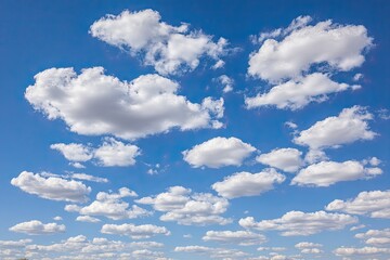 Obraz premium A vast expanse of a vibrant blue sky dotted with fluffy white cumulus clouds (1)