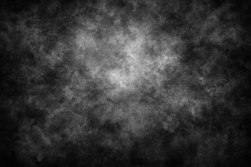 Dark, textured grayscale background with light center