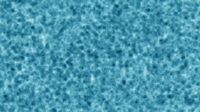 A computer-generated shot of a realistic water surface texture, showing blue rippling waves with light and shadow variations. The effect looks like underwater light caustics or a pool/ocean surface,