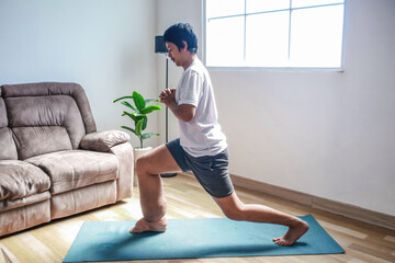 Man With Lymphedema Doing Exercise on Yoga Mat at Home Working on His Strength and Physical Therapy