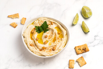 Homemade vegan hummus. Tasty vegan snack. Light background.