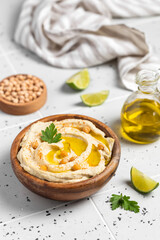Homemade vegan hummus. Tasty vegan snack. Light background.
