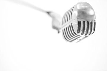 An old school microphone hanging from the ceiling - monochrome - horizontal