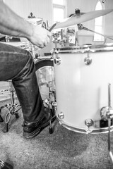 drummer in action in monochrome - vertical