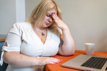 Stressed woman feeling anxious overwhelmed burnout, working remote job at home. Mental health, fatigue, frustration and digital stress.