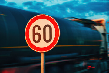 Cistern truck speeding by the speed limit traffic sign, motion blur image