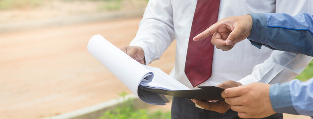 Building consultant. engineer and contractor discussing material specification from client in...