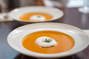 Gourmet Tomato Soup with Foam and Herb Garnish in a Japanese Restaurant