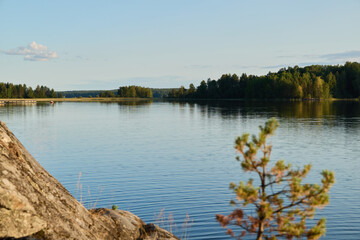 A Beautiful and Serene Lakeside View featuring Lush Greenery and Calm, Reflective Waters