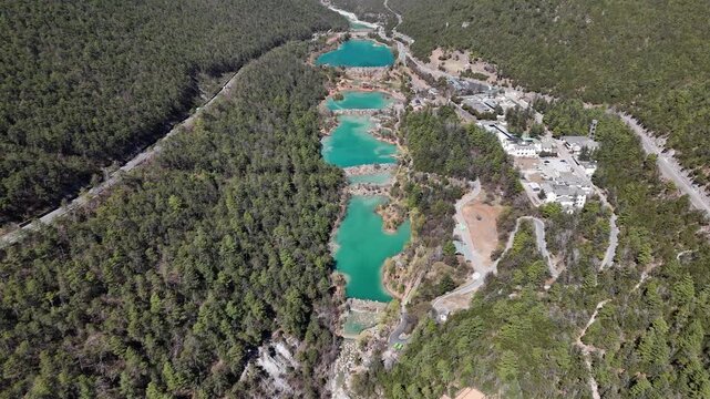 Aerial view of Baisuihe river flowing through the Blue Moon Valley a popular spot inside the Jade Dragon Snow Mountain Scenic Area of Lijiang, in Yunnan province, China.
