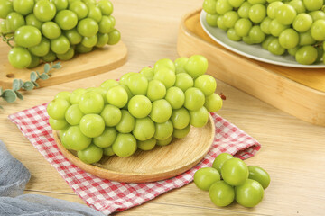 Fresh Green Grapes on Wooden Plates with Checkered Napkin - Healthy Organic Fruits Display