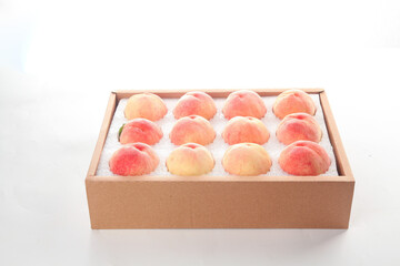 Fresh Yangshan Peaches from Wuxi in Gift Box on White Background