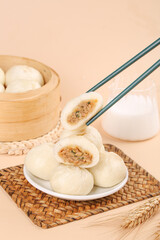 Fresh Xiao Long Bao Dumplings with Chopsticks on Bamboo Steamer - Traditional Chinese Dim Sum Breakfast