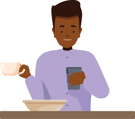 Smiling man using mobile phone and drinking coffee at breakfast table