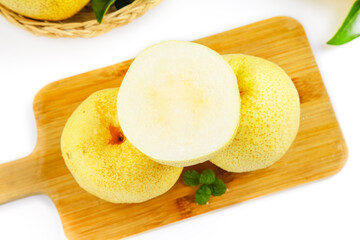 Fresh Dangshan White Pear Slices from Anhui China on Wooden Board with White Background