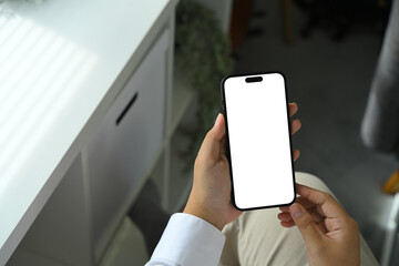 Hand holding smartphone with blank screen, mockup template for mobile app or website design