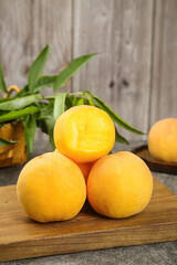 Fresh Yellow Peaches on Wooden Board with Green Leaves - Rustic Kitchen Food Photography