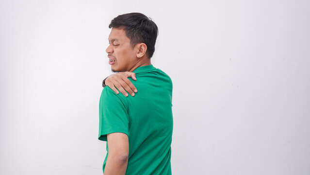 Asian young man suffering upper back pain pain isolate on white background
