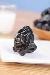 Dried Prunes California Xinjiang Air-Dried Fruit Healthy Snack Food Ingredient on White Plate