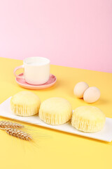Artisanal Vanilla Cupcakes with Coffee and Eggs on Colorful Background - Bakery Dessert Concept
