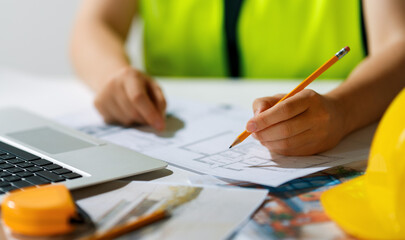 Woman architect is working on plans