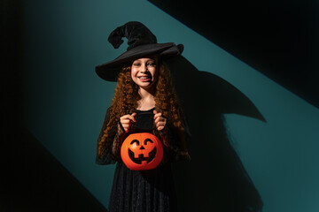 girl with Halloween pumpkin